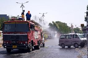 Workers Spray Disinfectant On The Road In Ajmer - India
