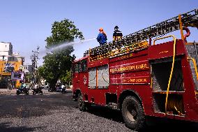 Workers Spray Disinfectant On The Road In Ajmer - India