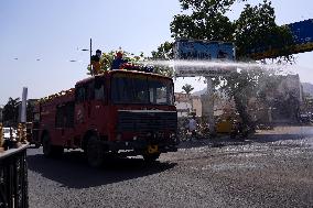 Workers Spray Disinfectant On The Road In Ajmer - India