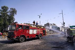 Workers Spray Disinfectant On The Road In Ajmer - India