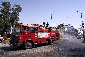 Workers Spray Disinfectant On The Road In Ajmer - India