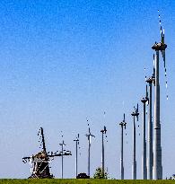 Windmill Alongside Wind Turbines - Netherlands