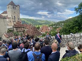 President Macron During A Visit In Saint-Cirq-Lapopie