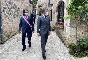 President Macron During A Visit In Saint-Cirq-Lapopie