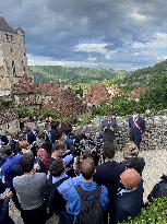 President Macron During A Visit In Saint-Cirq-Lapopie