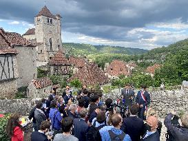 President Macron During A Visit In Saint-Cirq-Lapopie