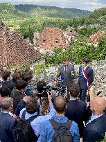 President Macron During A Visit In Saint-Cirq-Lapopie