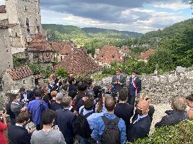 President Macron During A Visit In Saint-Cirq-Lapopie