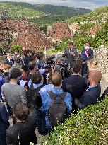 President Macron During A Visit In Saint-Cirq-Lapopie