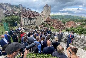 President Macron During A Visit In Saint-Cirq-Lapopie