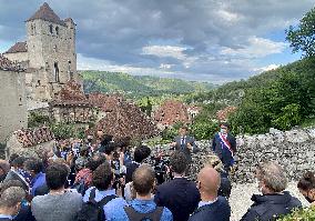 President Macron During A Visit In Saint-Cirq-Lapopie