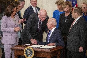 US President Joe Biden participates in a bill signing ceremony for the Crime Victims Fund Act of 2021