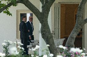 U.S. President Joe Biden walks into the Oval Office with Jake Sullivan, National Security Advisor,