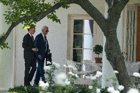 U.S. President Joe Biden walks into the Oval Office with Jake Sullivan, National Security Advisor,