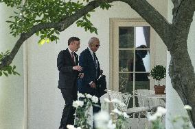 U.S. President Joe Biden walks into the Oval Office with Jake Sullivan, National Security Advisor,