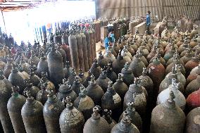 Workers supply oxygen tanks as new Delta variant of Covid-19