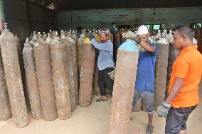 Workers supply oxygen tanks as new Delta variant of Covid-19