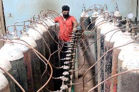 Workers supply oxygen tanks as new Delta variant of Covid-19