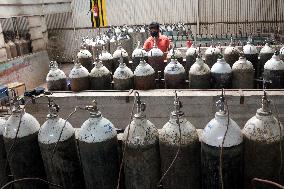 Workers supply oxygen tanks as new Delta variant of Covid-19