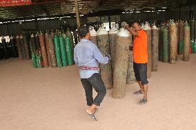 Workers supply oxygen tanks as new Delta variant of Covid-19