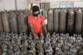 Workers supply oxygen tanks as new Delta variant of Covid-19