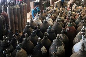 Workers supply oxygen tanks as new Delta variant of Covid-19