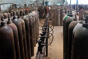 Workers supply oxygen tanks as new Delta variant of Covid-19