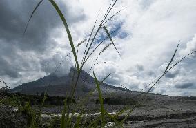 Daily-life Under Shadows Sinabung Eruption - Indonesia