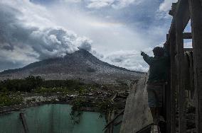 Daily-life Under Shadows Sinabung Eruption - Indonesia