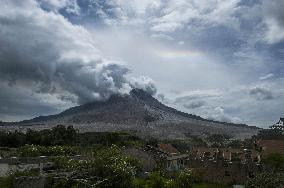 Daily-life Under Shadows Sinabung Eruption - Indonesia