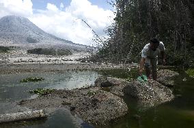 Daily-life Under Shadows Sinabung Eruption