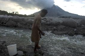 Daily-life Under Shadows Sinabung Eruption