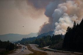 July Mountain Wildfire Burns Along Highway - Canada