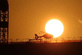 Helicopter Landing In Front Of A Sunset - Bern