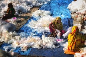 Collecting Raw Material In A Polythene Factory - Bangladesh