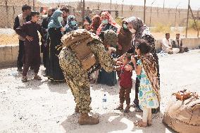 Soldiers with Babies at Hamid Karzai International Airport - Kabul