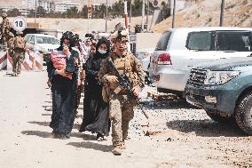 Soldiers with Babies at Hamid Karzai International Airport - Kabul