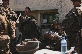 Soldiers with Babies at Hamid Karzai International Airport - Kabul