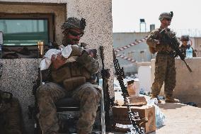 Soldiers with Babies at Hamid Karzai International Airport - Kabul