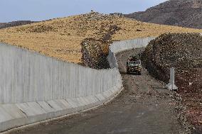 Turkey tightens security measures, builds wall along its border with Iran