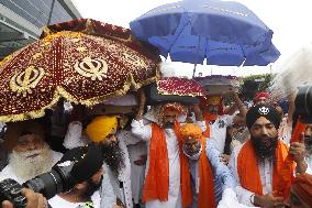 Sikh's Members Carry 3 Saroops Of Sri Guru Granth Sahibat At Airport - Delhi