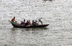 Boatman Transports Passenger On The River - Dhaka