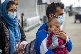 Afghan Refugees Arrive At Dulles Airport - Virginia