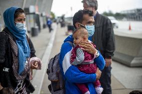 Afghan Refugees Arrive At Dulles Airport - Virginia