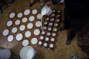 Preparing traditional yogurt in Bhaktapur, Nepal
