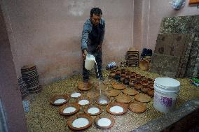 Preparing traditional yogurt in Bhaktapur, Nepal