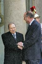 President Jacques Chirac greets his Algerian counterpart Abdelaziz Bouteflika at the Elysee Palace