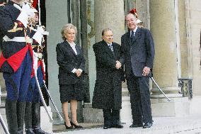 President Jacques Chirac greets his Algerian counterpart Abdelaziz Bouteflika at the Elysee Palace