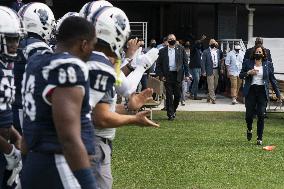 Kamala Harris flips a coin ahead of Howard University vs Hampton University football game