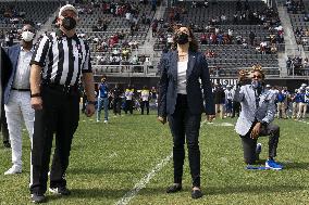 Kamala Harris flips a coin ahead of Howard University vs Hampton University football game